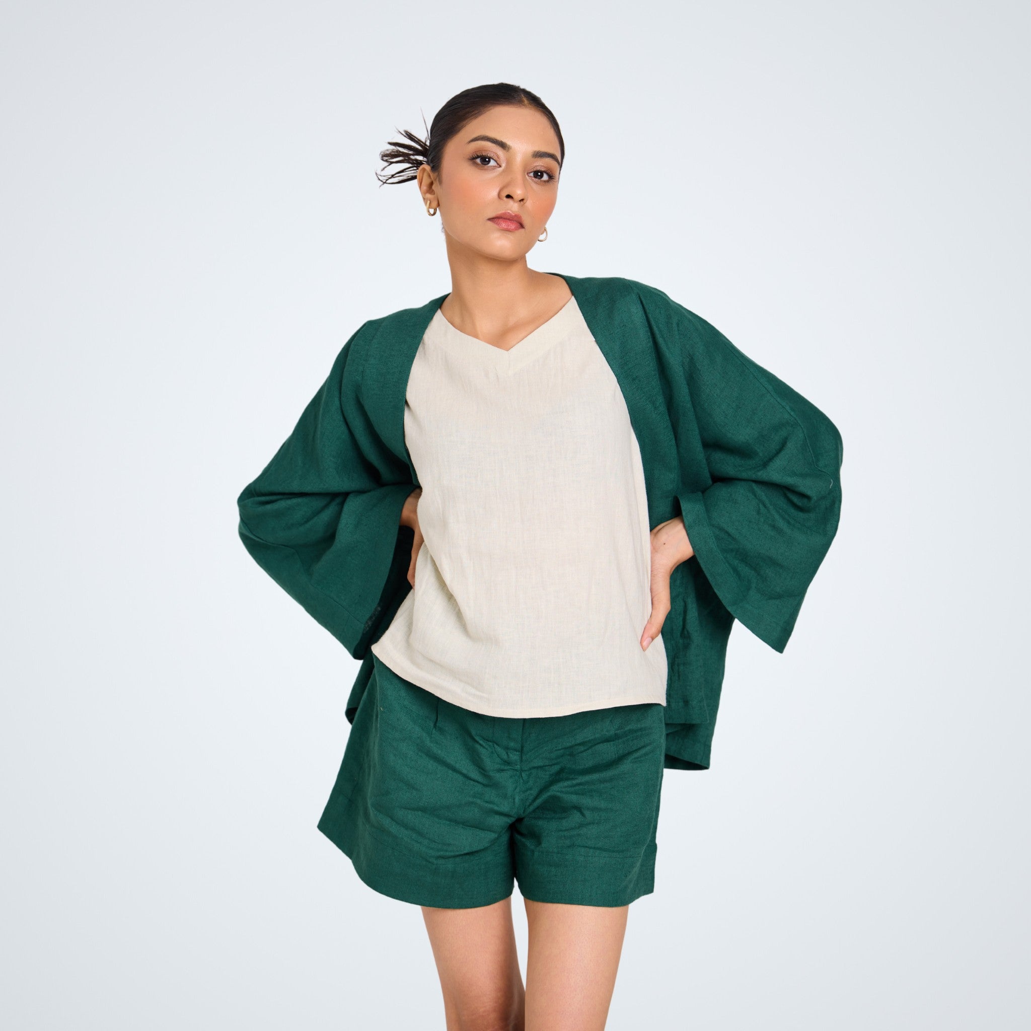 Short emerald linen shrug with roomy sleeves. Breathable, versatile, and weightless – perfect over tanks, dresses, or playsuits | Selfish Clarity