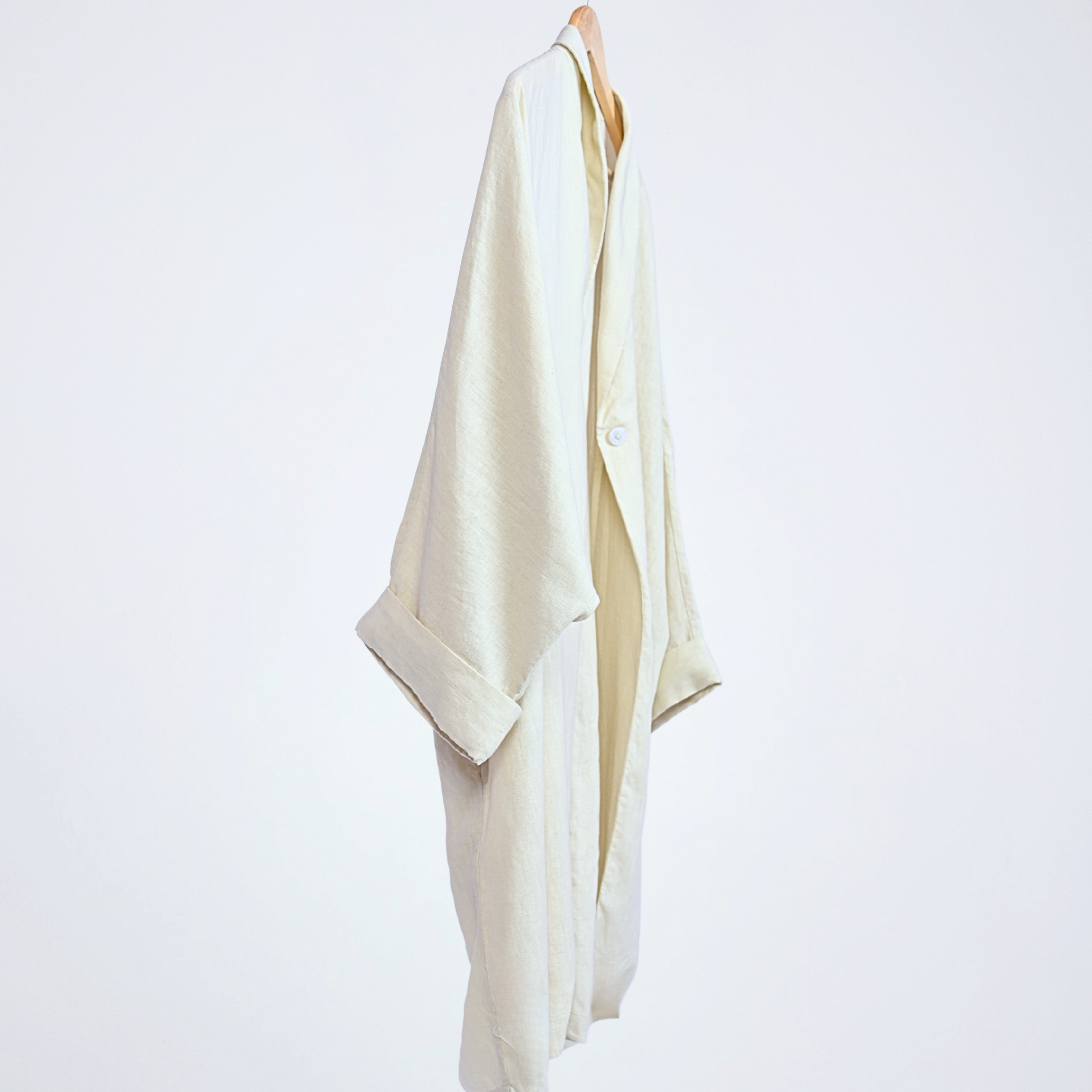 Pearl linen long shrug with a lapel collar and a button. Breathable, flowing, and versatile for no-effort layering | Selfish Clarity
