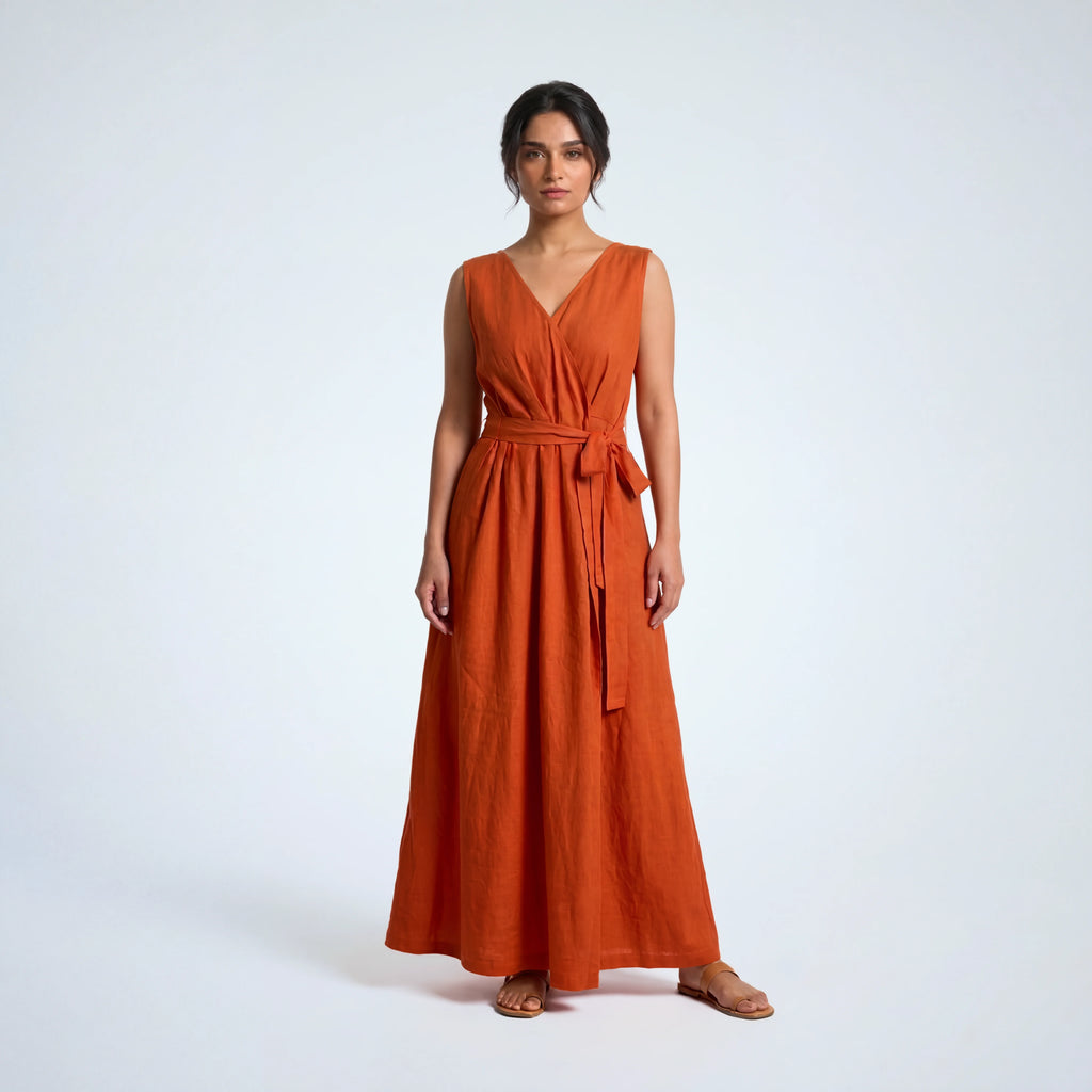 Sleeveless orange rust linen dress with pleated wrap fall. Breathable, relaxed, and fluid for moving forward with ease | Selfish Clarity