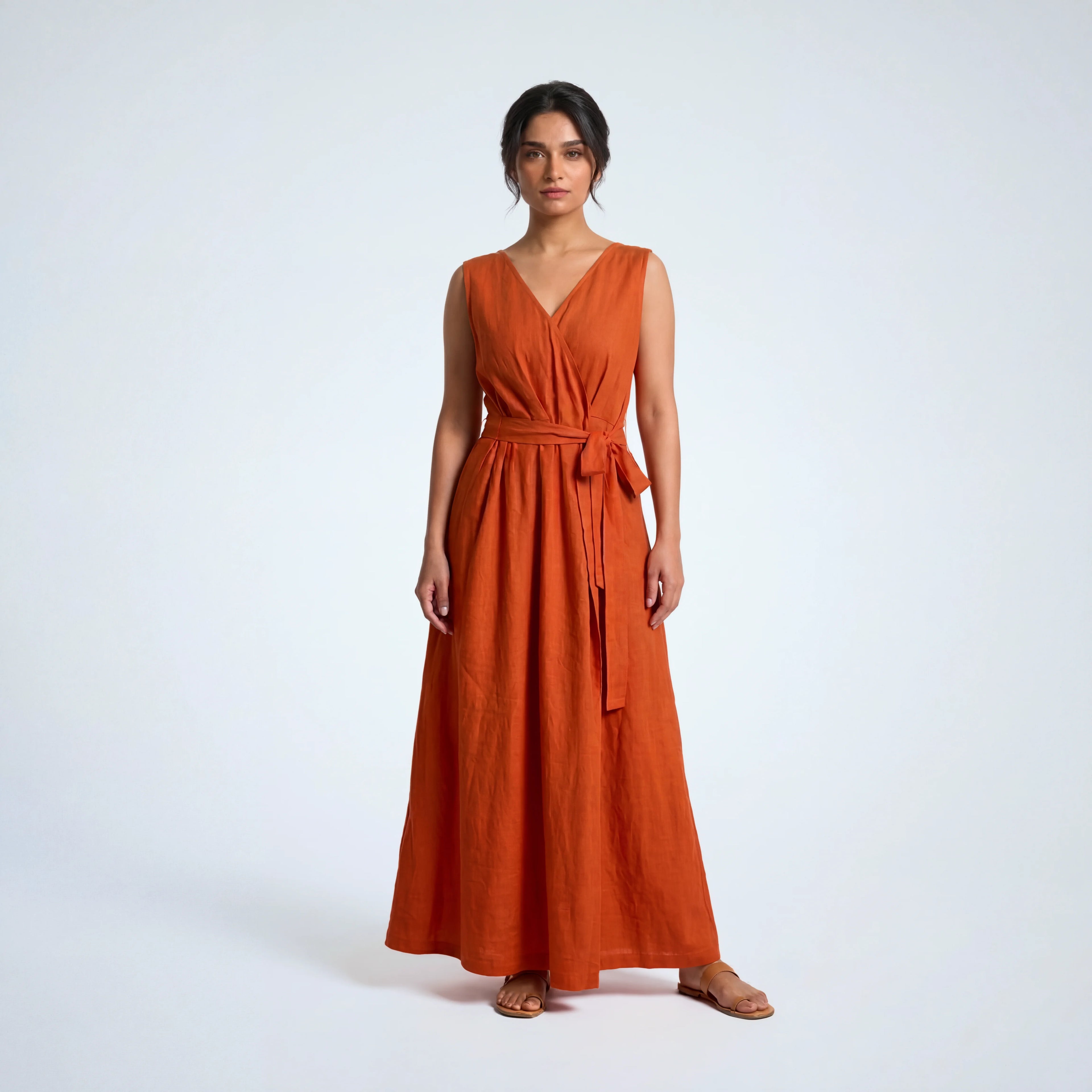 Sleeveless orange rust linen dress with pleated wrap fall. Breathable, relaxed, and fluid for moving forward with ease | Selfish Clarity