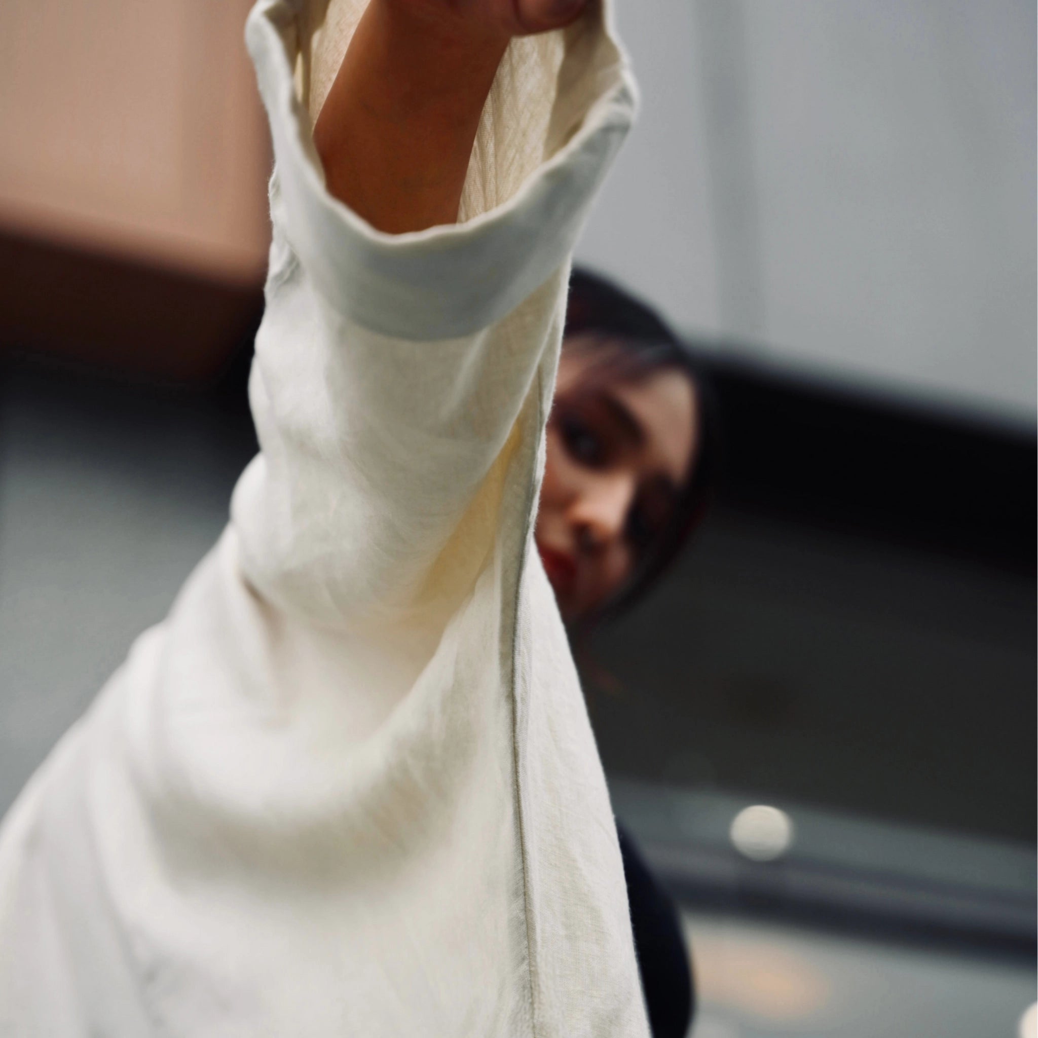 Pearl linen long shrug with a lapel collar and a button. Breathable, flowing, and versatile for no-effort layering | Selfish Clarity