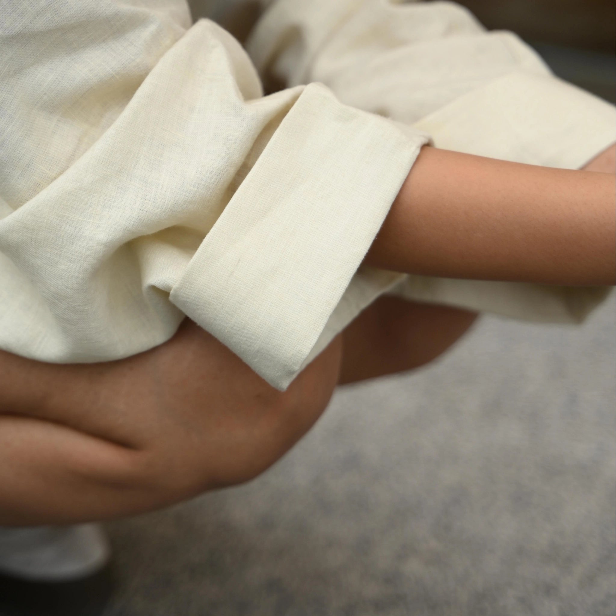 Pearl linen long shrug with a lapel collar and a button. Breathable, flowing, and versatile for no-effort layering | Selfish Clarity