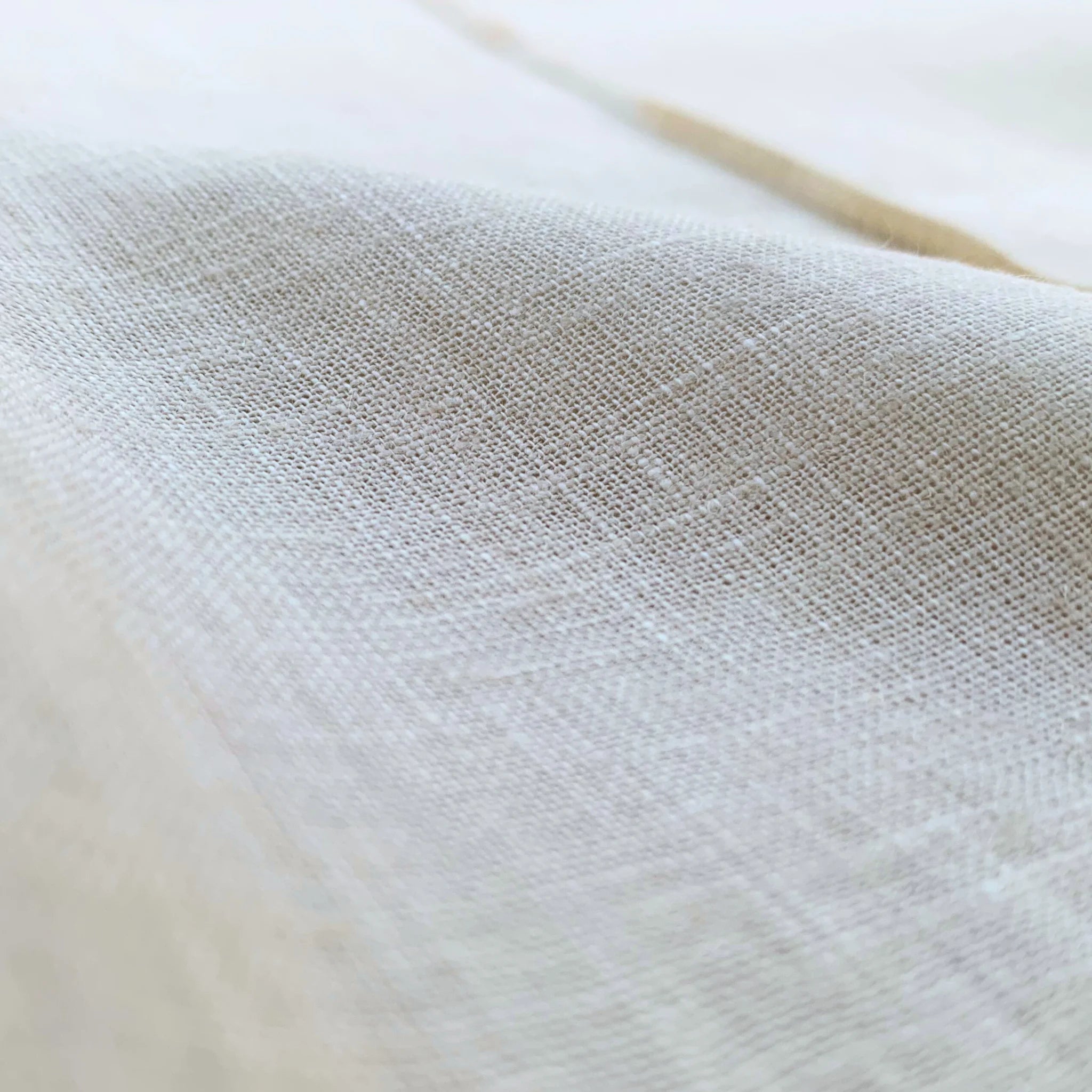 Close-up of textured pearl linen fabric