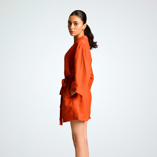 Relaxed linen playsuit with ¾ sleeves, roomy shorts, and a belt. Breathable comfort and effortless movement for any day