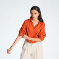 A breathable, relaxed-fit orange rust linen shirt that adapts to your flow. Lightweight, versatile, and built for effortless everyday style | Selfish Clarity